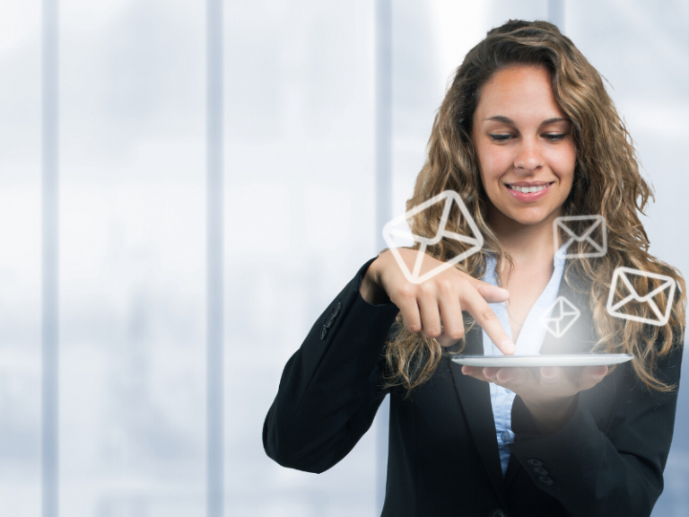 woman with a finger on her tablet, genereting envelope holograms