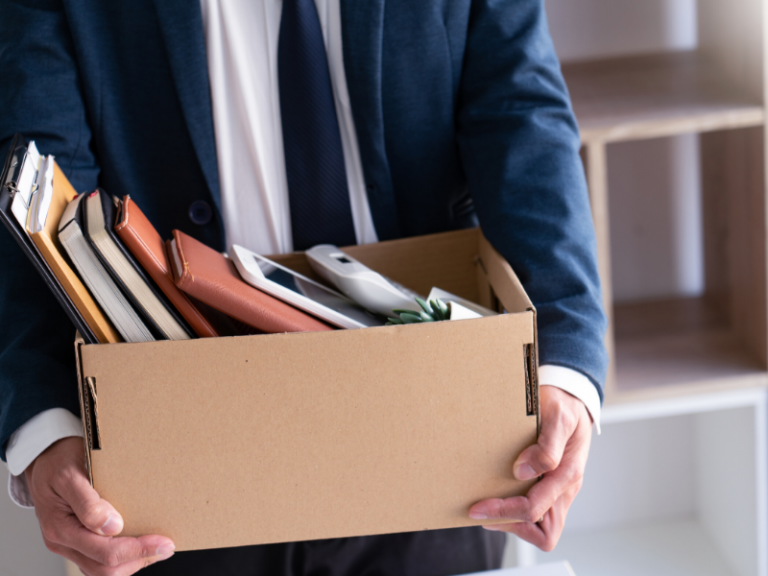 business man holding a box of their possesings